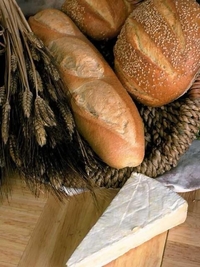 Beautiful section filled with premium glass art cutting boards with rich grains, loaves of bread, delicious pastries, pies, tortes, and irresistible desserts. Our glass boards can also be used as a bread board, or serving tray.