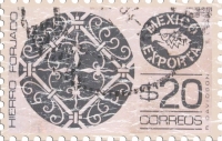This stamp from Mexico shows filigree ironwork with the words Hierro Forjado Mexico Exporta next to it.