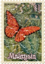 Known as Malaya until 1963, this stamp from Malaysia shows a bright orange butterfly against green foliage. These shirts have a lightly distressed look for an aged appearance.