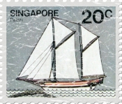 Officially the Republic of Singapore, this stamp shows a drawing of a sailing vessel. These shirts have a lightly distressed look for an aged appearance.