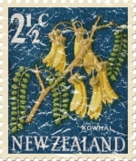 This New Zealand stamp shows the kowhai flower, a common plant in New Zealand gardens. These shirts have a lightly distressed look for an aged appearance.