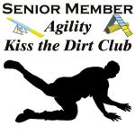 The fun part of agility is making light of the mistakes that we make. This dog agility shirt shows a person falling to the ground, and thence invited to the "Agility Kiss the Dirt Club" Ptui brush off and go on.