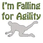 Looking for a special dog agility tee shirt, sweat shirt or tank top? The person falling down is a unique perspective. Above the figure is the text "I'm Falling for Agility" Funny?